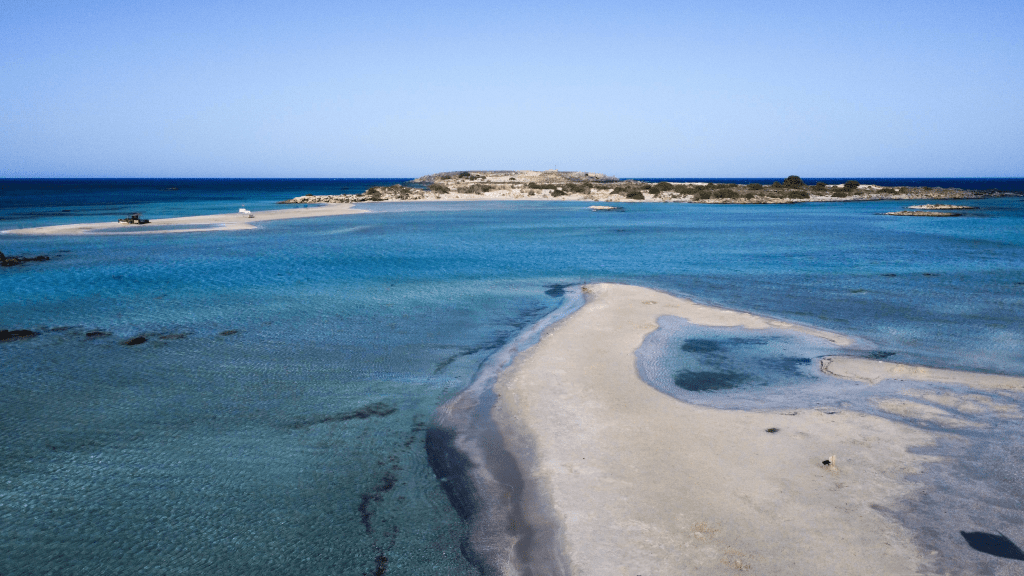 Elafonisi – Your Travel Guide to Crete’s Famous Pink Beach Elafonisi Beach from above – lagoon, sandbar, and islet in southwestern Crete