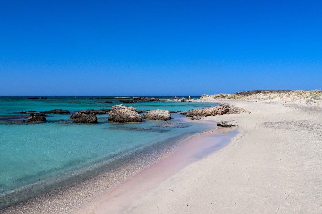 Elafonisi – Your Travel Guide to Crete’s Famous Pink Beach Pink sand and turquoise sea at Elafonisi beach in Crete