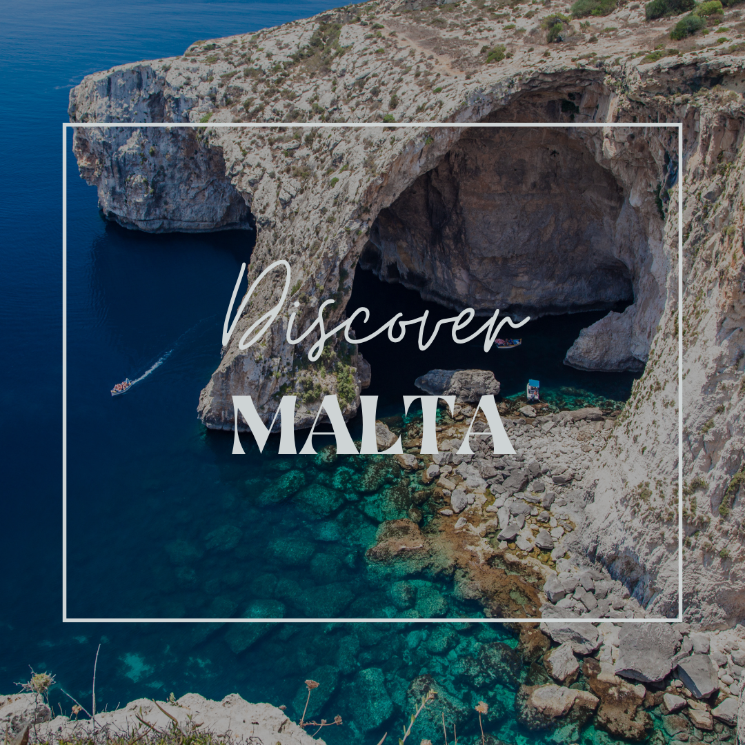 Aerial view of a beautiful coastal cave in Malta with clear turquoise water and a small boat nearby.