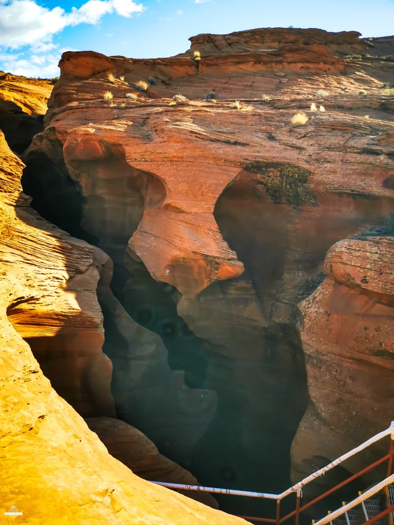 Antelope Canyon entrance area with stairs and red rock formations in Arizona
