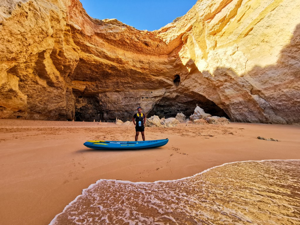 Our Top 7 Beaches in the Algarve Empty beach inside Benagil Cave with a kayak on the sand